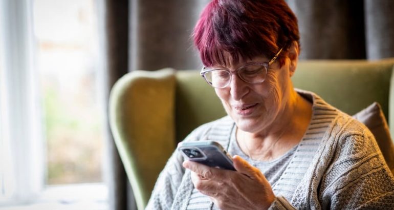 Ageing-Better-Lady-using-phone-at-home-digital-technology-900x600-1