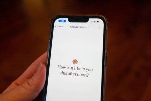 Close-up of a person's hand holding a smartphone and using the Opus 4 model within the Claude app from AI company Anthropic, Lafayette, California, May 22, 2025. (Photo by Smith Collection/Gado/Getty Images)