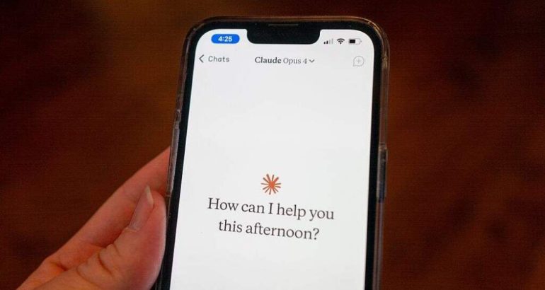 Close-up of a person's hand holding a smartphone and using the Opus 4 model within the Claude app from AI company Anthropic, Lafayette, California, May 22, 2025. (Photo by Smith Collection/Gado/Getty Images)