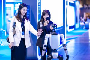 Visitors-to-BEYOND-Expo-interact-with-robots-1-scaled